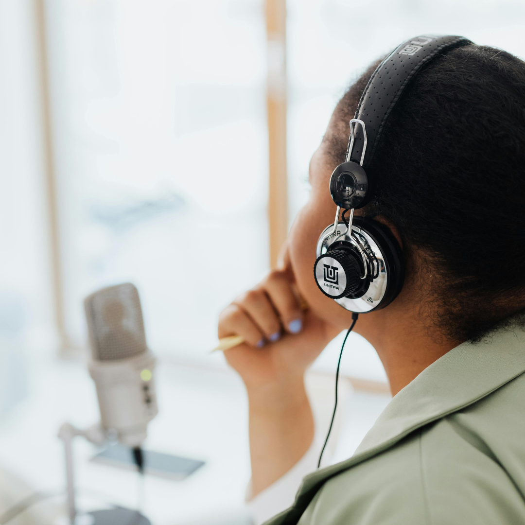 • content creator choosing marketing platform • entrepreneur planning blog podcast youtube strategy • laptop microphone and camera on desk • content planning notebook with marketing ideas